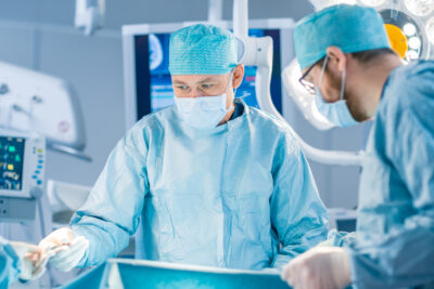 Shot,In,The,Operating,Room,,Assistant,Hands,Out,Instruments,To